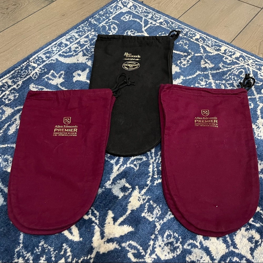 Three pairs of specialty Allen Edmonds shoe bags.